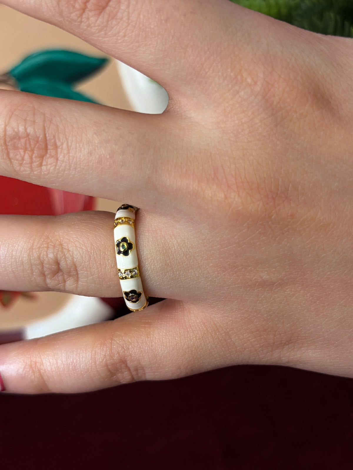 Black Flowers In White Enamel Ring